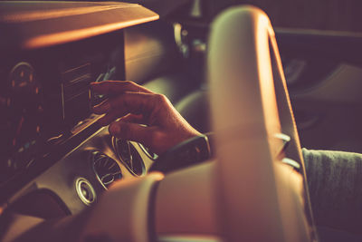 Cropped hand of man playing guitar