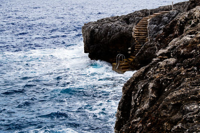 View of sea by rock formation