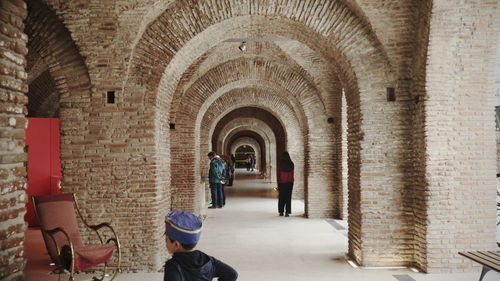 Rear view of people in historic building