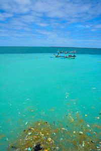 Scenic view of sea against blue sky