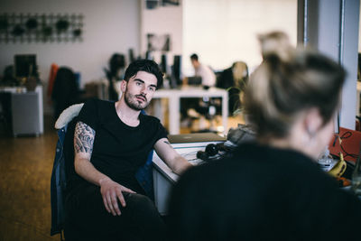 Young man sitting at home