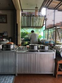 Rear view of people working in restaurant