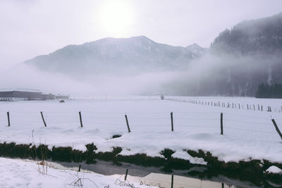 Scenic view of snow covered field