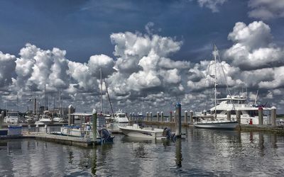 Boats moored at harbor