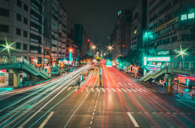 Light trails on city street at night