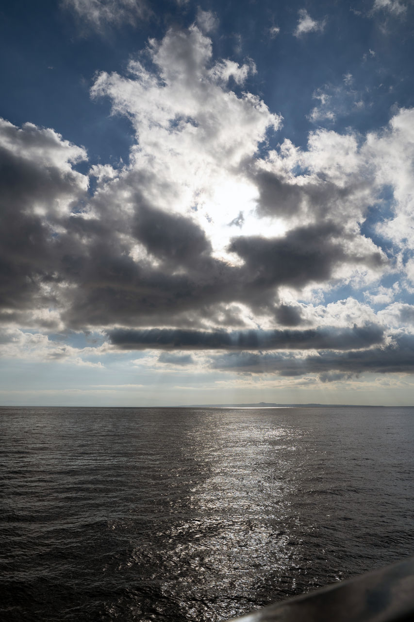 sky, cloud, water, sea, horizon, horizon over water, scenics - nature, beauty in nature, sunlight, nature, ocean, tranquility, environment, tranquil scene, cloudscape, no people, seascape, coast, reflection, land, outdoors, beach, wave, idyllic, shore, dramatic sky, day, travel, blue, body of water, dusk, urban skyline, travel destinations