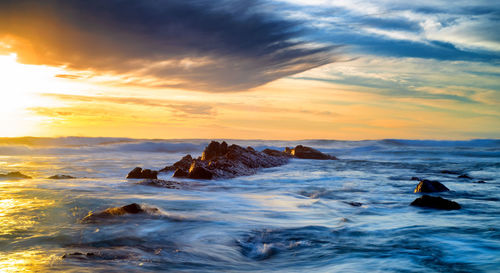 Scenic view of sea against sky during sunset