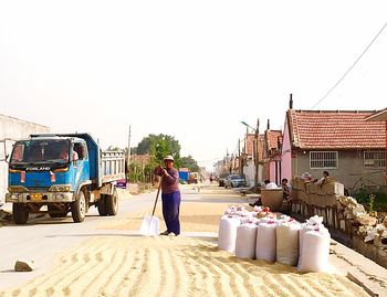 Rear view of woman walking on street
