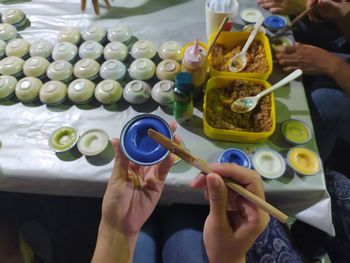 High angle view of people having food at table