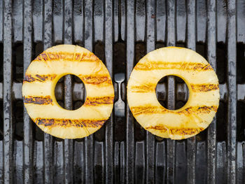 Directly above shot of yellow slices on wood