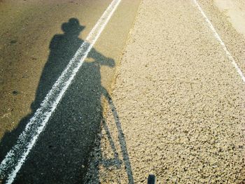 Shadow of people on road