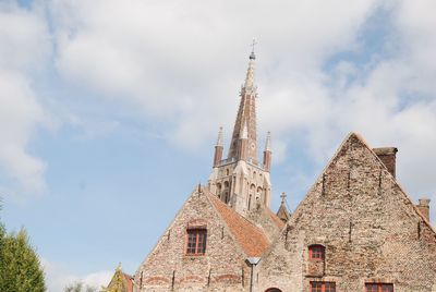 Low angle view of cathedral against cloudy sky