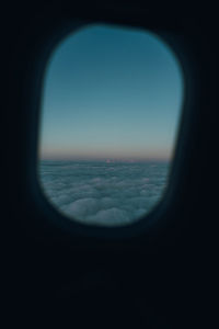 View of sea seen through airplane window