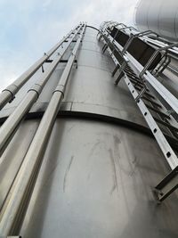 Low angle view of crane against sky