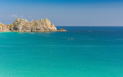 Scenic view of sea against blue sky