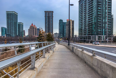 Modern buildings in city against sky