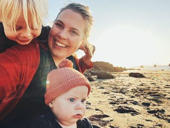 Lady with two children at the beach 