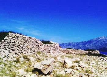 Scenic view of landscape against blue sky