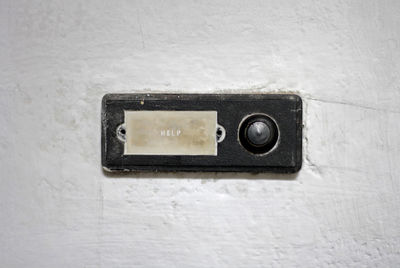 Close-up of old camera on wall