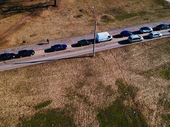 High angle view of cars on field