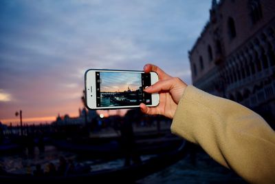 Man photographing with mobile phone