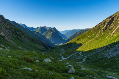 Scenic view of mountains against clear blue sky