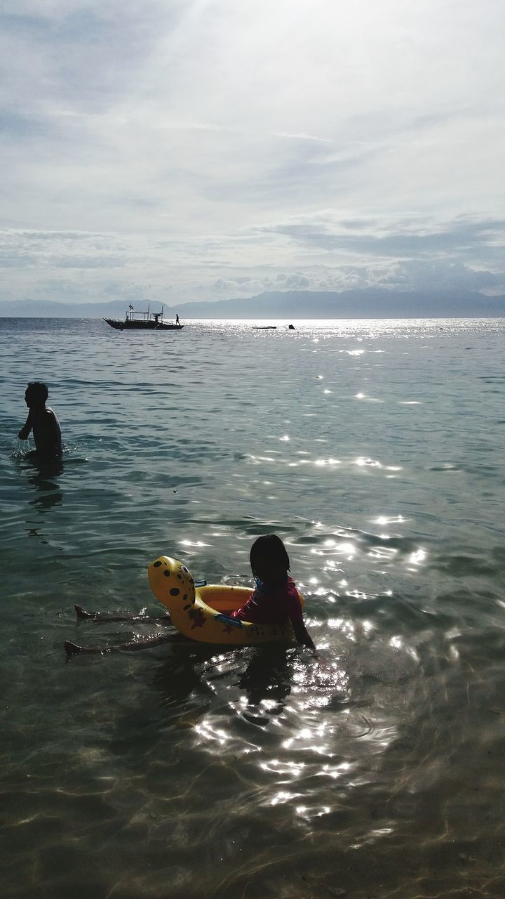 MAN SURFING IN SEA