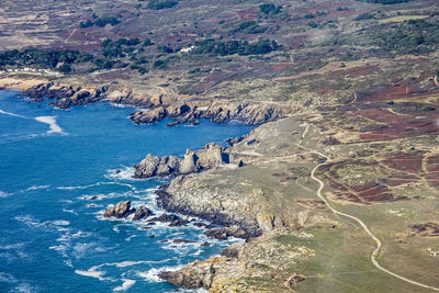 High angle view of landscape by sea against sky