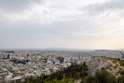 Aerial view of cityscape against sky