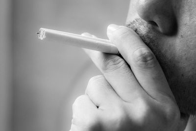 Close-up of man smoking cigarettes