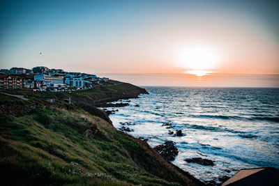 Scenic view of sea against sky during sunset