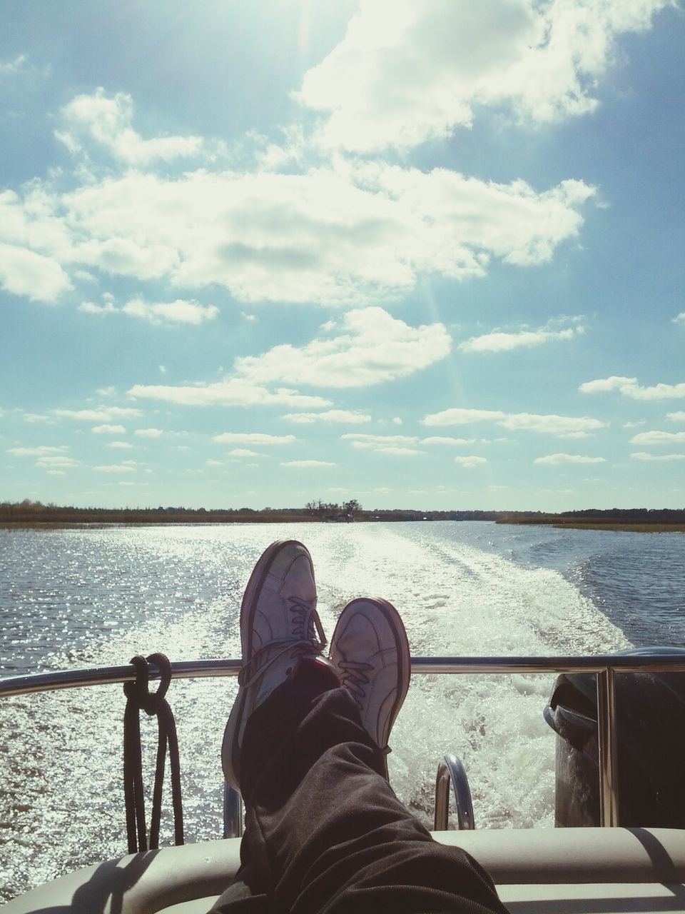 water, sea, transportation, personal perspective, mode of transport, sky, part of, low section, person, men, nautical vessel, lifestyles, railing, cloud - sky, leisure activity, cropped, travel