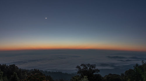 Scenic view of landscape against sky at night