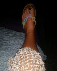 Low section of woman wearing shoes