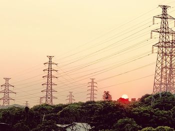 Low angle view of electricity pylon against sky