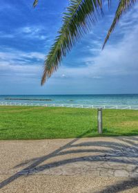 Scenic view of sea against cloudy sky