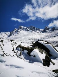 Scenic view of snowcapped mountains against sky