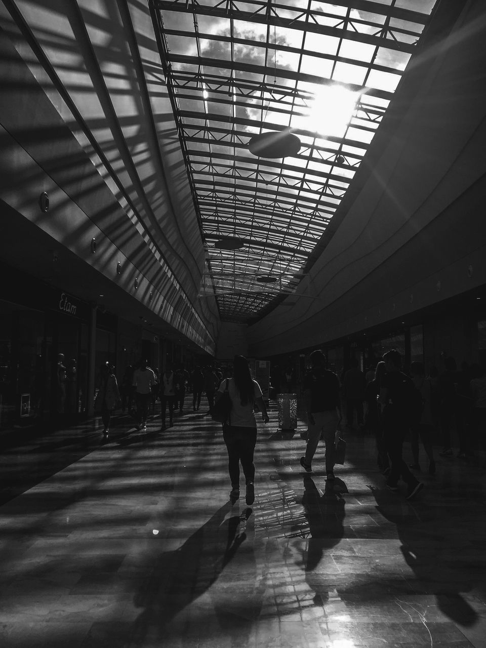 PEOPLE WALKING ON RAILROAD STATION