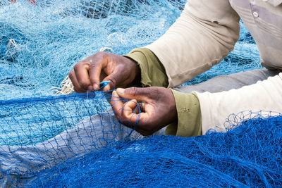 Fisherman holding fishing net