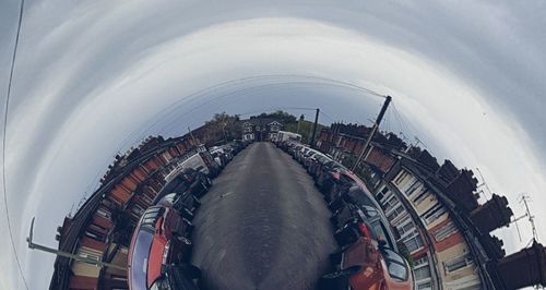 High angle view of city against cloudy sky