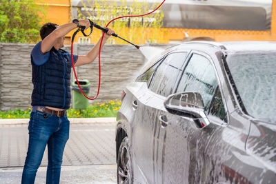 Man holding car