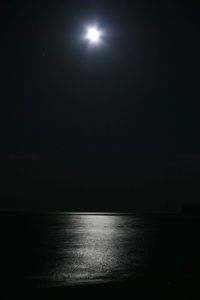 Scenic view of sea against sky at night