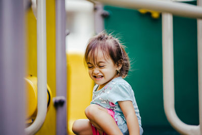 Portrait of cute girl smiling in playground