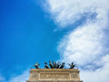 Low angle view of historical building against cloudy sky