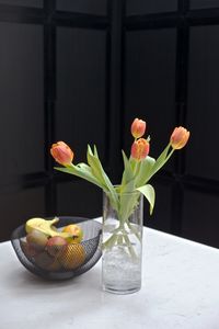 Close-up of flower vase on table at home