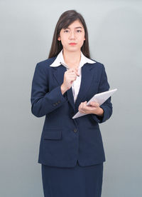 Portrait of a beautiful young woman over white background