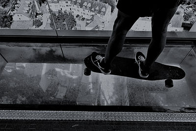 Low section of man skateboarding on skateboard