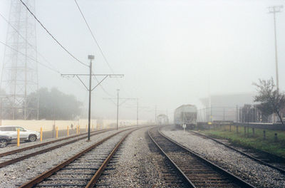 Railroad tracks against clear sky