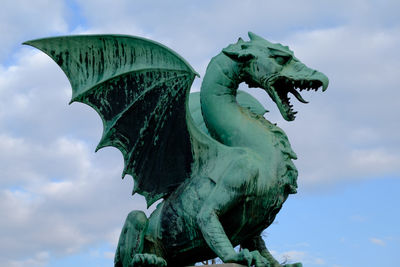 Low angle view of statue against sky