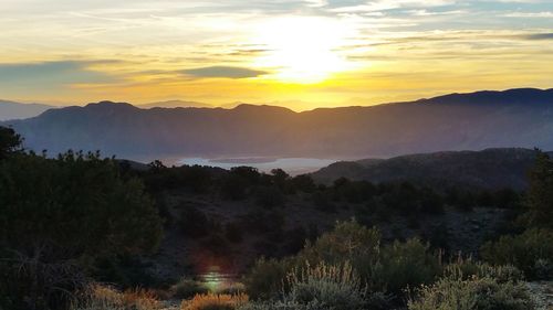 Scenic view of mountains against sky during sunset